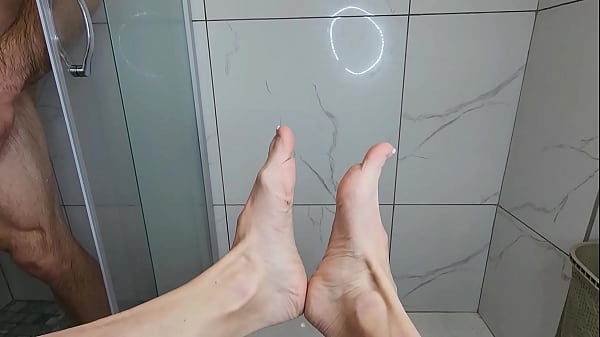 Foot job on COCK morning shower.